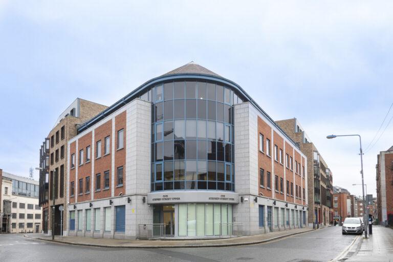 This project involved the renovation of the ground floor from open plan meeting spaces to an open plan office. It includes a number of private spaces and a large boardroom that is divided with a combination of acoustic and glazed partitions. In order to extend the open plan area, we filled in the existing stairwell to a basement with concrete. Originally, there was a commercial kitchen toilet changing room and store in the basement. We demolished all partitions and removed all floor and wall partitions. We then refitted new partitions. This included a canteen, two meeting rooms, male/female toilets, shower and changing rooms, store area, new ducting for heat recovery units, and passive fire duct fitted for the lobby area. We also completed all floor and wall finishes. Externally, we removed the façade and installed a new one. Following this, we fitted an entrance to suit the new ground floor layout. We also fitted a new emergency door leading to a laneway and removed and replaced an old bar door with a new window to match.