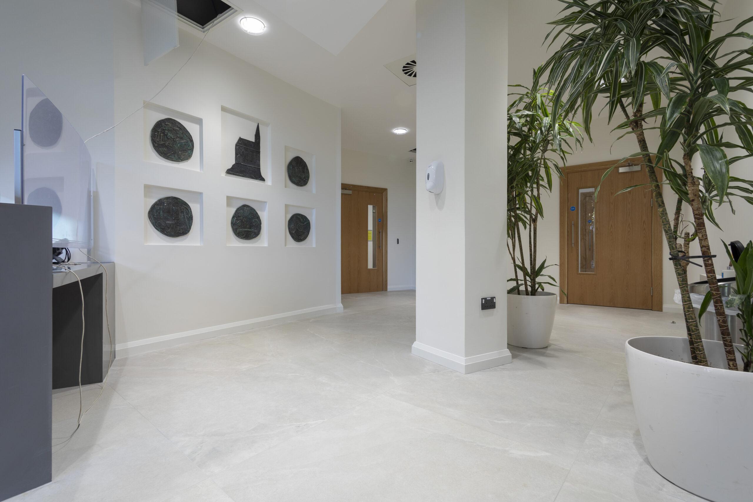 This project involved the renovation of the ground floor from open plan meeting spaces to an open plan office. It includes a number of private spaces and a large boardroom that is divided with a combination of acoustic and glazed partitions. In order to extend the open plan area, we filled in the existing stairwell to a basement with concrete. Originally, there was a commercial kitchen toilet changing room and store in the basement. We demolished all partitions and removed all floor and wall partitions. We then refitted new partitions. This included a canteen, two meeting rooms, male/female toilets, shower and changing rooms, store area, new ducting for heat recovery units, and passive fire duct fitted for the lobby area.  We also completed all floor and wall finishes. Externally, we removed the façade and installed a new one. Following this, we fitted an entrance to suit the new ground floor layout. We also fitted a new emergency door leading to a laneway and removed and replaced an old bar door with a new window to match.